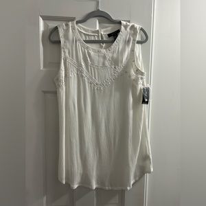 Women’s small white top    Brand new. Never worn. Tags still ok